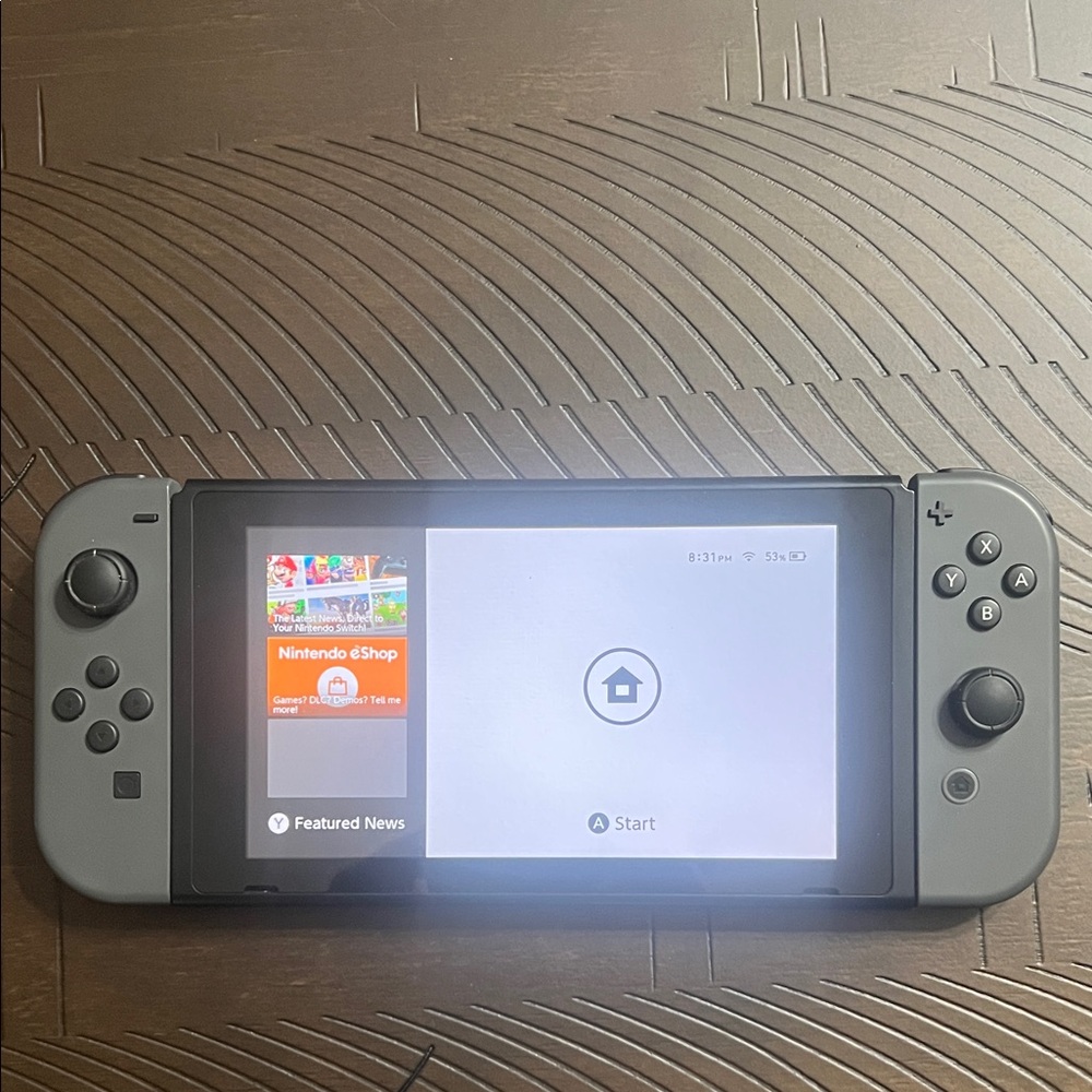 Nintendo Switch with Gray Joy‑Con Controllers